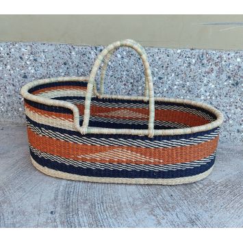 A baby Moses basket or bassinet with tan edging. It has a black border outside the orange or rust border centre