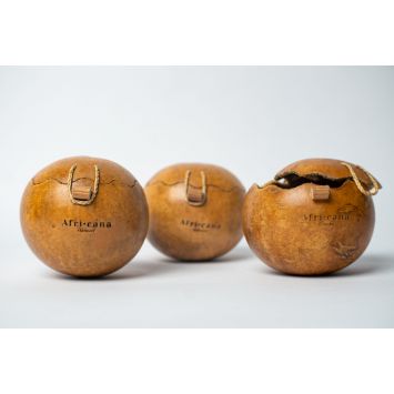 Side view of three Africana -labeled calabashes that are latched.