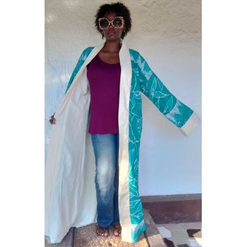 Model wearing a blue and white batik duster jacket over a purple top and blue jeans