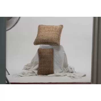 Front view of two brown Crispy Woven cushions on a white sheet