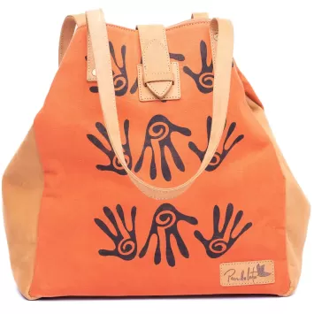 Orange handmade Kofi Tote bag with brown decorative hands on the bag