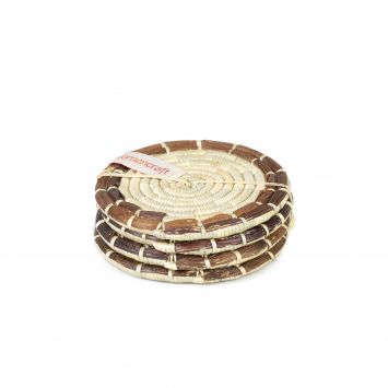 Four Banana Brown and natural tan round grass woven coasters stacked on top of each other bound together with a natural tan string
