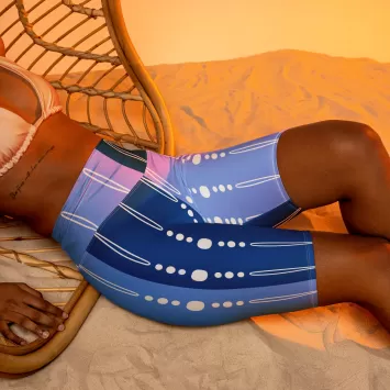 Front view of Blue Tribal Lines Biker Shorts on model lying down