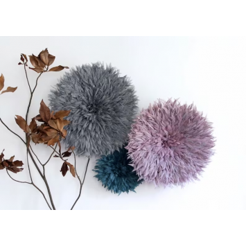 Grey, turquoise and mauve Bamileke juju hats on the wall