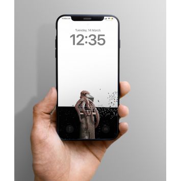 A hand holding a phone which presents a lock screen showing an octopus wrapped around a lighthouse in a white and black background