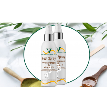 Two bottles if Foot Spray with circle mirror and palm leaves