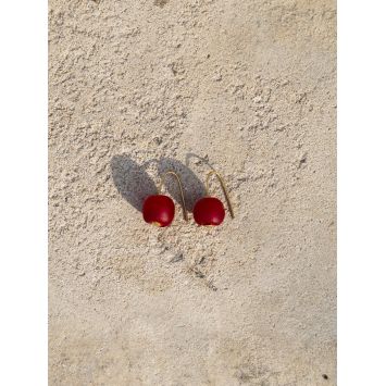 Flatlay of a pair of  red Awia earrings