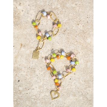 Flatlay of two multi-colored Tuka Bracelets
